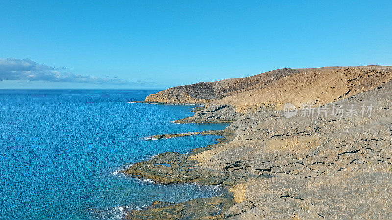 Aerial view of the beach "Playa Escondida" and the natural reserve of "Montaña Pelada" in Tenerife (Canary Islands). Drone shot